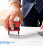 Businessman analyst working with graph, chart and stamp. business strategy finance statement report graph approve concept